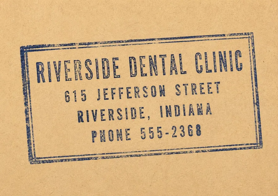 A worn rubber stamp impression in blue ink on kraft paper, type only, landed slightly off square